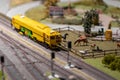 Toy train for railway repair stands on rails, railway station