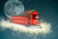 Toy train travelling in sparkling snow to bring christmas presents