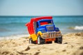 Toy truck on the beach.