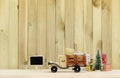 Toy truck carries gifts and a Christmas tree. Photo in vintage style Royalty Free Stock Photo