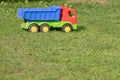 Toy truck on grass, abandoned toy Royalty Free Stock Photo