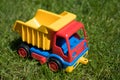 Toy truck model on grass - dumper car Royalty Free Stock Photo