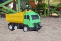 Toy truck in the sand. Children`s toy Royalty Free Stock Photo