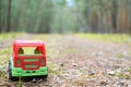 Toy truck on a shady forest road Royalty Free Stock Photo