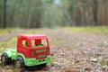 Toy truck on a shady forest road Royalty Free Stock Photo