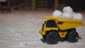 Toy truck with snowballs in the snow at night Royalty Free Stock Photo