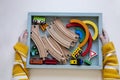 Toy vehicles Montessori material. Top view of the child hands. Home schooling Royalty Free Stock Photo