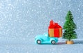 Toy vintage pickup truck parked by Christmas tree Royalty Free Stock Photo