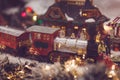 Toy vintage steam locomotive decorated Christmas tree Royalty Free Stock Photo