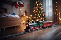 toy vintage steam locomotive on the floor under a decorated Christmas tree against the backdrop of a garland of bokeh lights Royalty Free Stock Photo