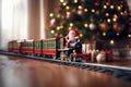 toy vintage steam locomotive on the floor under a decorated Christmas tree against the backdrop of a garland of bokeh lights Royalty Free Stock Photo