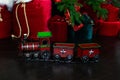 Toy vintage steam locomotive on floor under a decorated Christmas tree and gifts. Xmas toy train on Christmas tree background. Chr Royalty Free Stock Photo