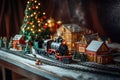 a toy vintage steam locomotive on a table under a decorated Christmas tree against the backdrop of a garland of bokeh lights Royalty Free Stock Photo