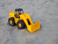 Toy Wheel Loader Excavator On The Sand At The Beach