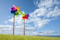 Toy windmill concept of green energy wind farm by the sea