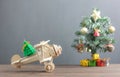 Toy wood airplane transfer fir tree with Blur Christmas tree & many beautiful gift box also essential decoration accessory. Royalty Free Stock Photo