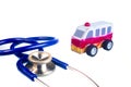 Toy wood ambulance car and stethoscope on white background. close up. Royalty Free Stock Photo