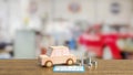 The toy wood car and blue calculator on wood table 3d rendering Royalty Free Stock Photo