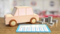 The toy wood car and blue calculator on wood table 3d rendering Royalty Free Stock Photo