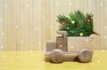 Toy wooden car and christmas tree Royalty Free Stock Photo