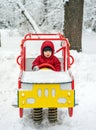 Toy wooden car in snow on playground Royalty Free Stock Photo