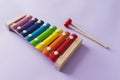 A toy wooden colorful xylophone on purple background with copy space. Children`s toy and musical instrument. Music and childhood Royalty Free Stock Photo