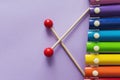 A toy wooden colorful xylophone on purple background with copy space. Children`s toy and musical instrument. Music and childhood Royalty Free Stock Photo