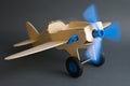 Toy wooden plane with rotating blue propeller