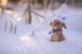 Toy woolly rabbit in a winter hat and scarf