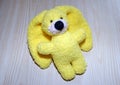 Toy yellow knitted hare. Manual work. Hobby - knitting.