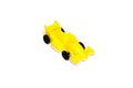 Toy yellow racing car on a white background, racing car Royalty Free Stock Photo