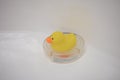 Toy yellow rubber duck for a bathtub on a stand Royalty Free Stock Photo