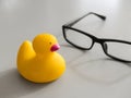 Toy yellow rubber duck on the desktop. Opposition symbol and political struggle Royalty Free Stock Photo