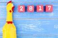 Toy yellow shrilling chicken and Happy new year 2017 number on r Royalty Free Stock Photo