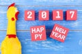 Toy yellow shrilling chicken and Happy new year 2017 number on r Royalty Free Stock Photo