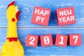 Toy yellow shrilling chicken and Happy new year 2017 number on r Royalty Free Stock Photo