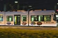 Toyama Tramcar passing in front of Toyama Chuo Post office in the night