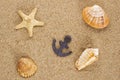 Toylike anchor and seashells Royalty Free Stock Photo