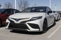 Toyota Camry Hybrid display. Toyota offers the Corolla in LE, SE, Nightshade, XLE, XSE, TRD V6, XLE V6 and XSE V6 models