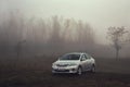 Toyota corolla in the fog Royalty Free Stock Photo