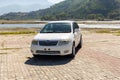 Toyota corolla white sedan car with a beautiful landscape background: Swat, Pakistan - 10 October 2023 Royalty Free Stock Photo