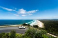 Toyota Landscruiser "Troopy" driving around bend at Cape Byron near the lighthouse