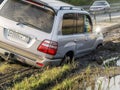 Toyota Lexus land cruiser 100 SUV car got stuck in a dirt trap on roadside Royalty Free Stock Photo