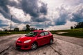 A Toyota Matrix in a old parking lot.