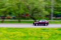 The Toyota RAV4 compact crossover moves at high speed along the street in summer. Moscow, Russia-April 2020 Royalty Free Stock Photo