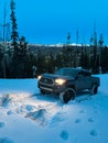 Truck Driving on Snow in Blue Hour