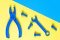 Toys background. Kids construction toys tools on blue and yellow background. Top view Royalty Free Stock Photo