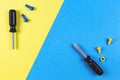 Toys background. Kids construction toys tools on blue and yellow background. Top view Royalty Free Stock Photo