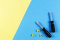 Toys background. Kids construction toys tools on blue and yellow background. Top view Royalty Free Stock Photo