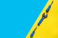 Toys background. Top view of toy tools on blue yellow background